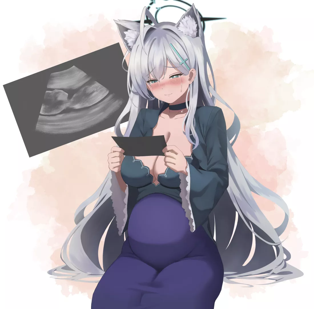 Happy Mother looking at the Ultrasound photo of her baby posted by Dear_Forever_1242