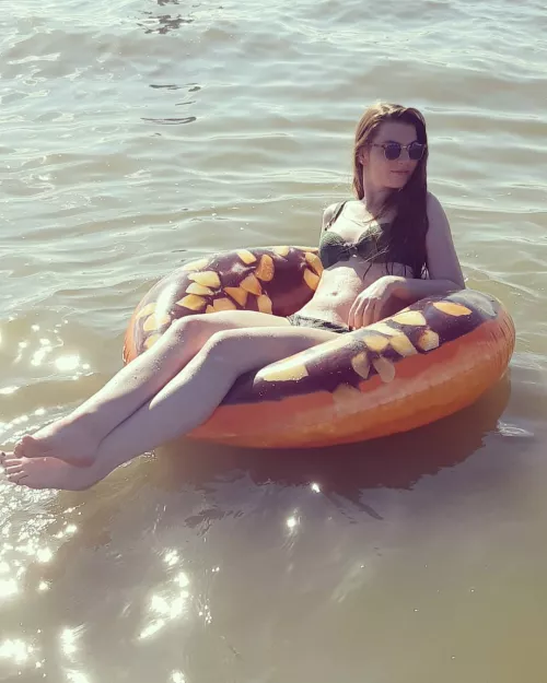 Bikini girl on rubber ring by GoodBishop628