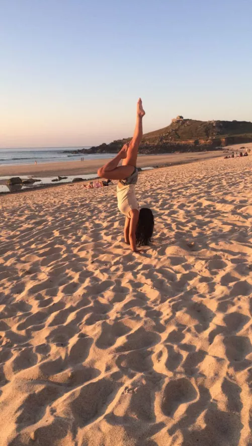 Handstand on a beach by Sexymialou