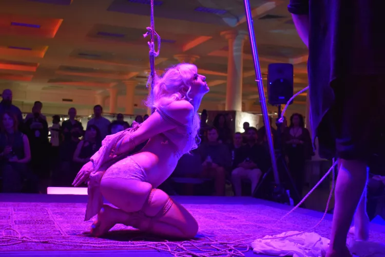 On her knees in front of a crowd by Knottydevil