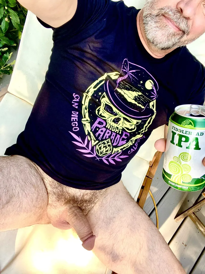 New shirt, my favorite beer and a cool breeze. Happy man by hairy_monkee