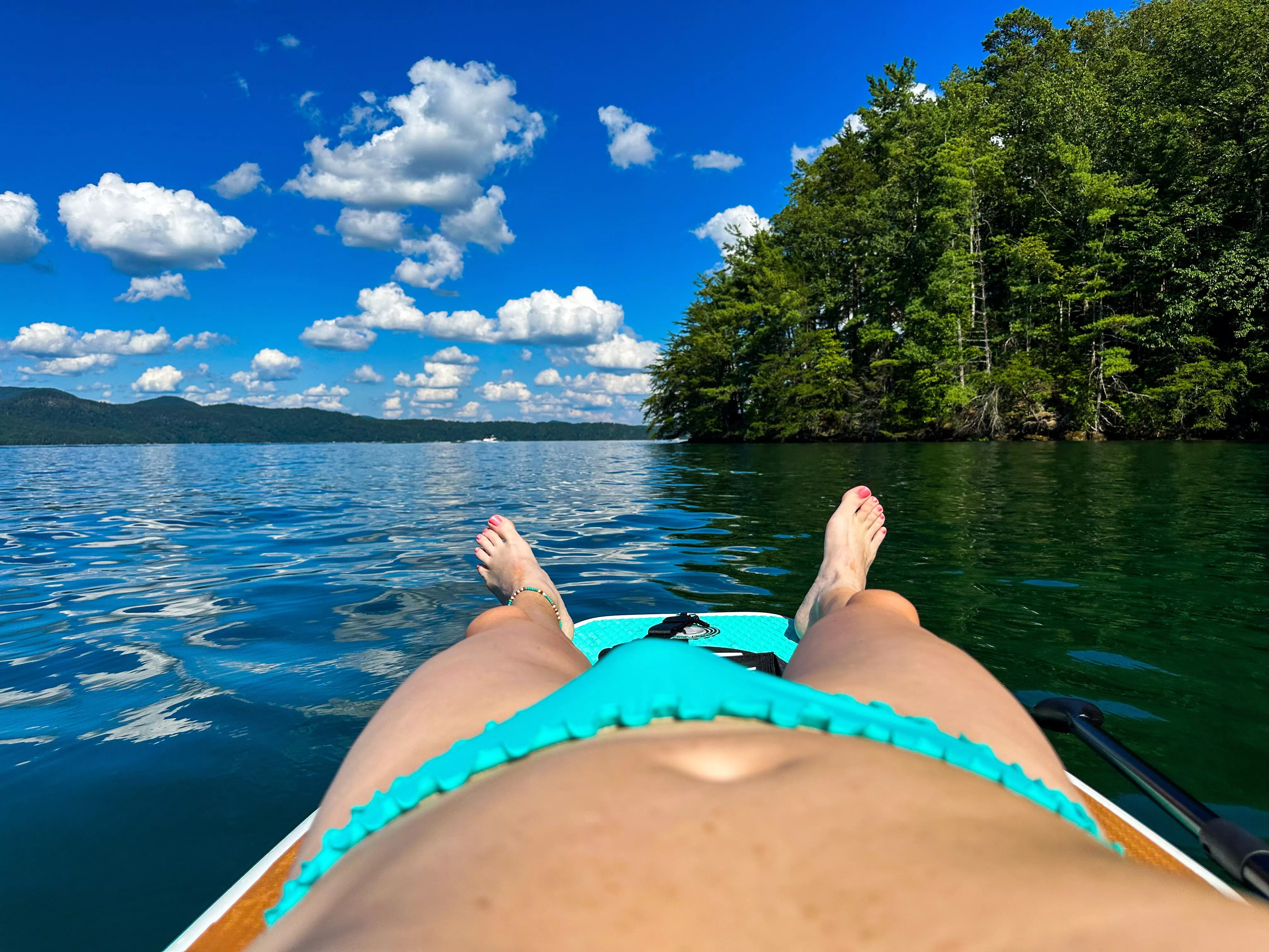 Enjoying the afternoon in my ruffled bikini on the lake. posted by BikiniRumRunner