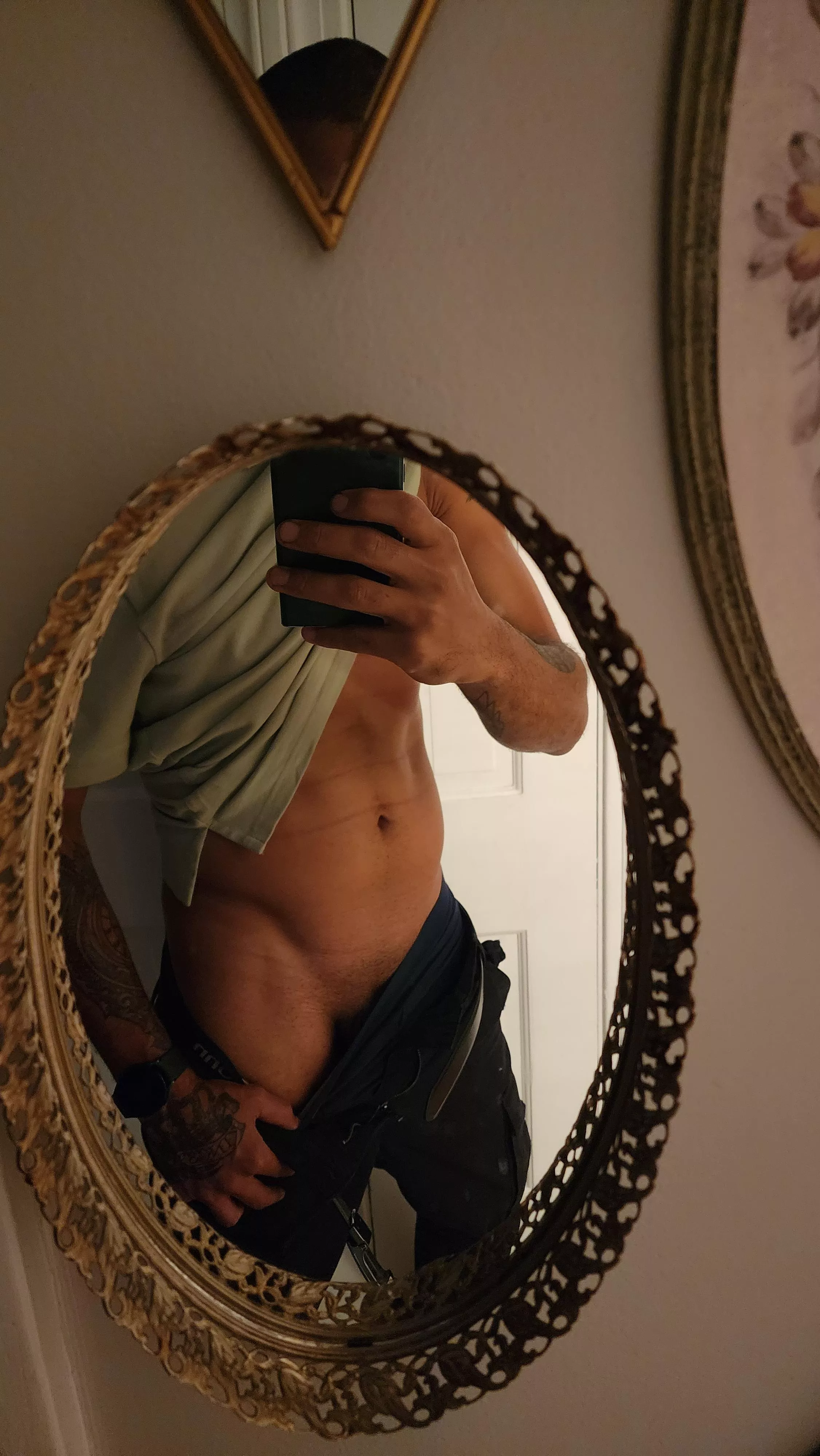 1 of my 56 mirrors that I have in my hallway...I wonder if this one is well hung posted by campky35