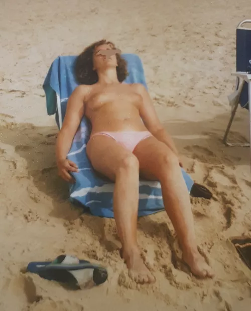My wife is tanning on the beach. by made-in-1967