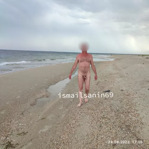 Naked by the sea after a thunderstorm by izmailchanin69