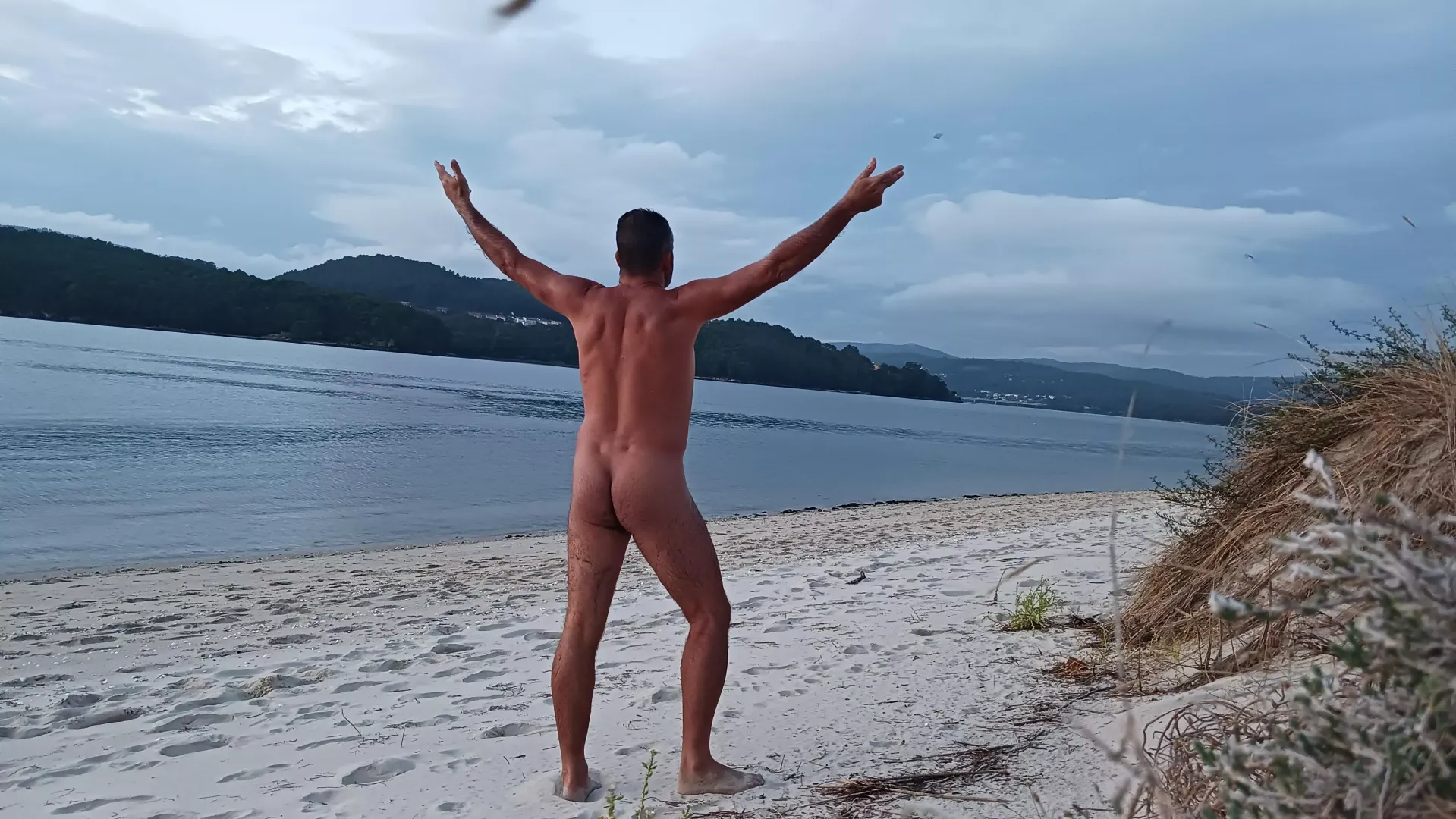 Enjoying cloudy beach day posted by nudebodytime