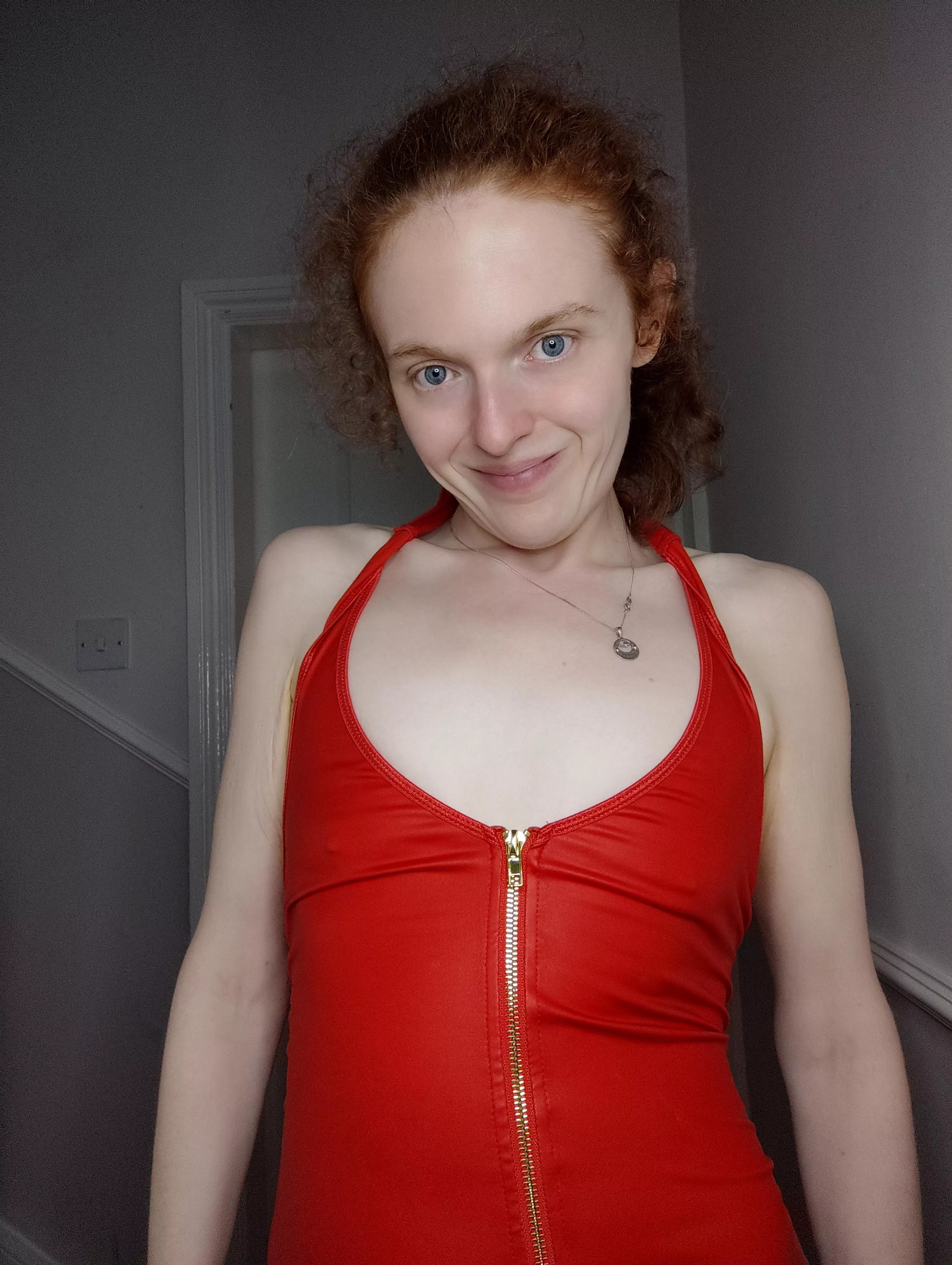 A redhead who is braless in a red dress posted by Hot-Campaign3260