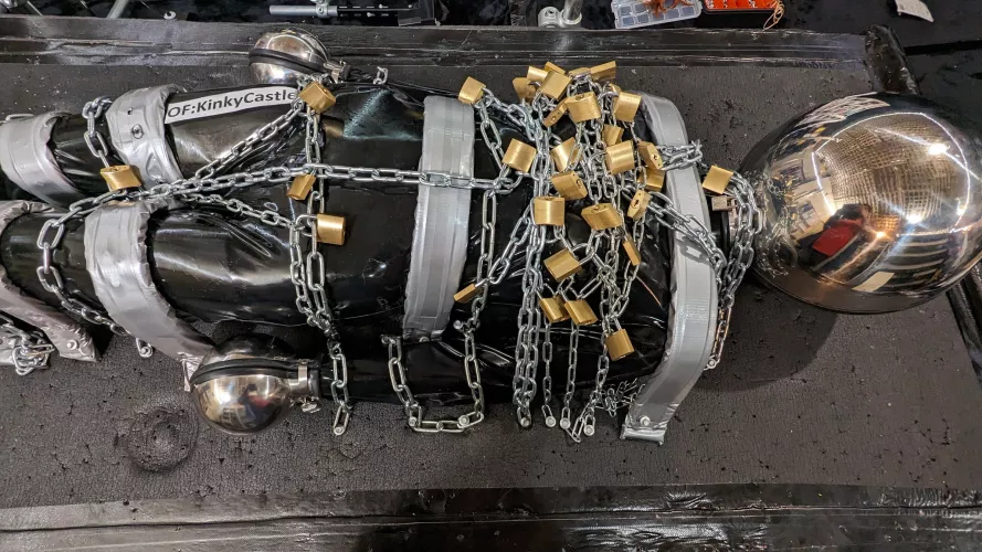 Every padlock was used.... 6kg of chain. Plus. Shiny latex. Shiny Hood. Shiny Mittens, etc. by Ash_577474