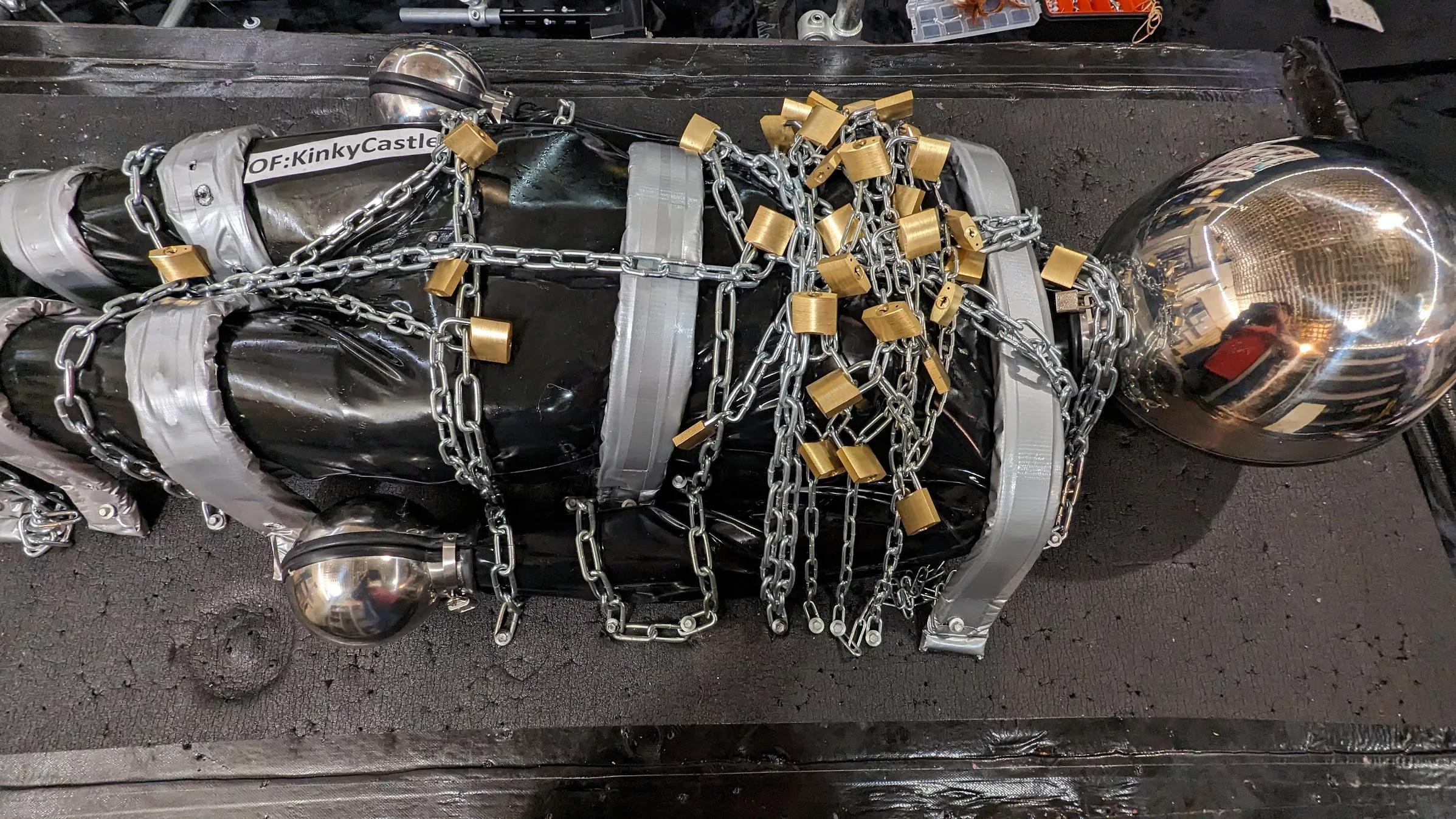 Every padlock was used.... 6kg of chain. Plus. Shiny latex. Shiny Hood. Shiny Mittens, etc. posted by Ash_577474