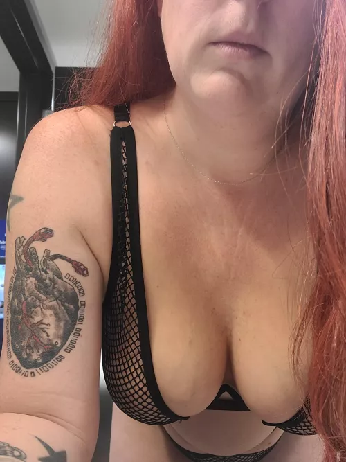 hanging cleavage in fishnets by chickincharge