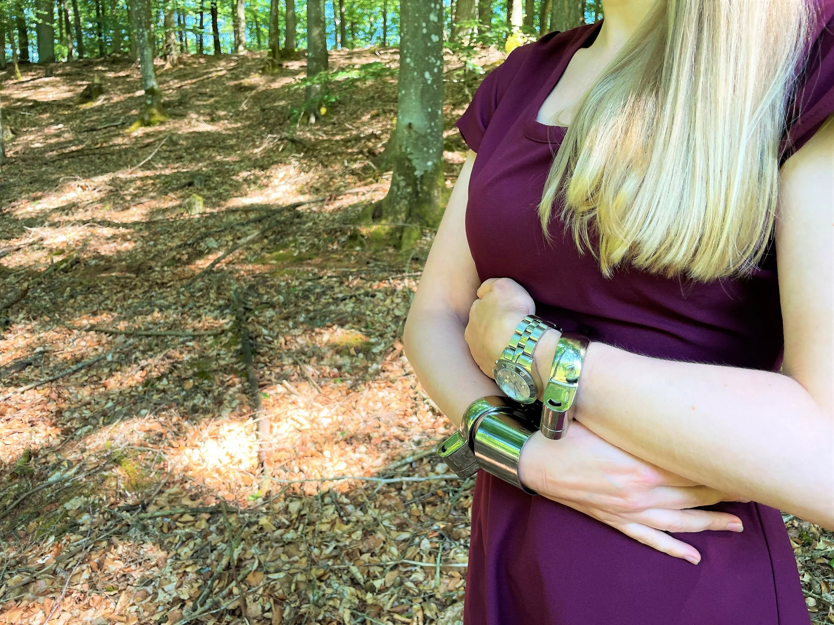 Wearing my KUB-128 cuffs while walking in the woods posted by JessicaShackled