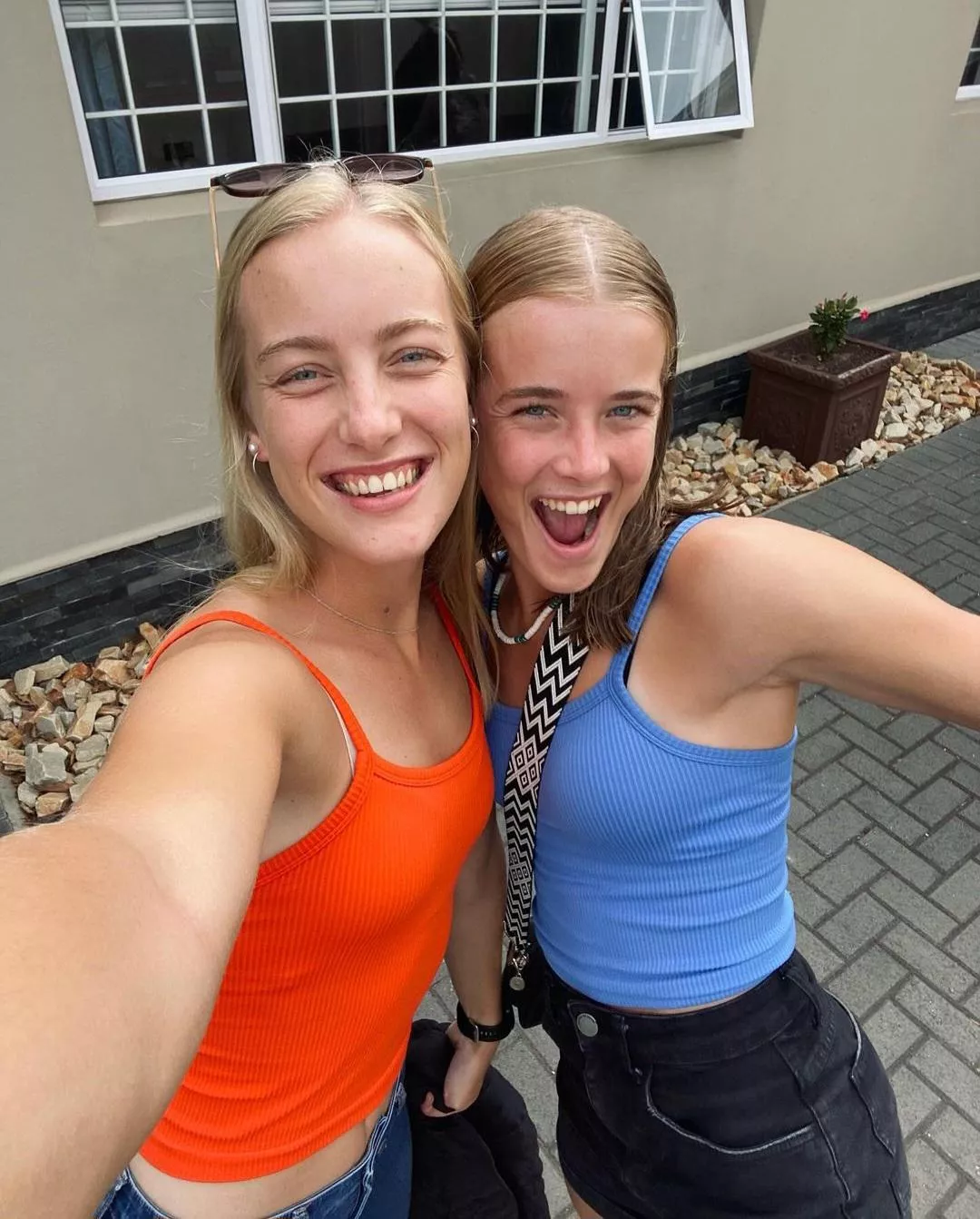 sisters' beige & black bra straps. (18+) posted by No_Working6435