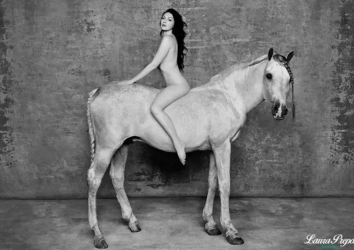 Laura Prepon on horseback by rockeerode