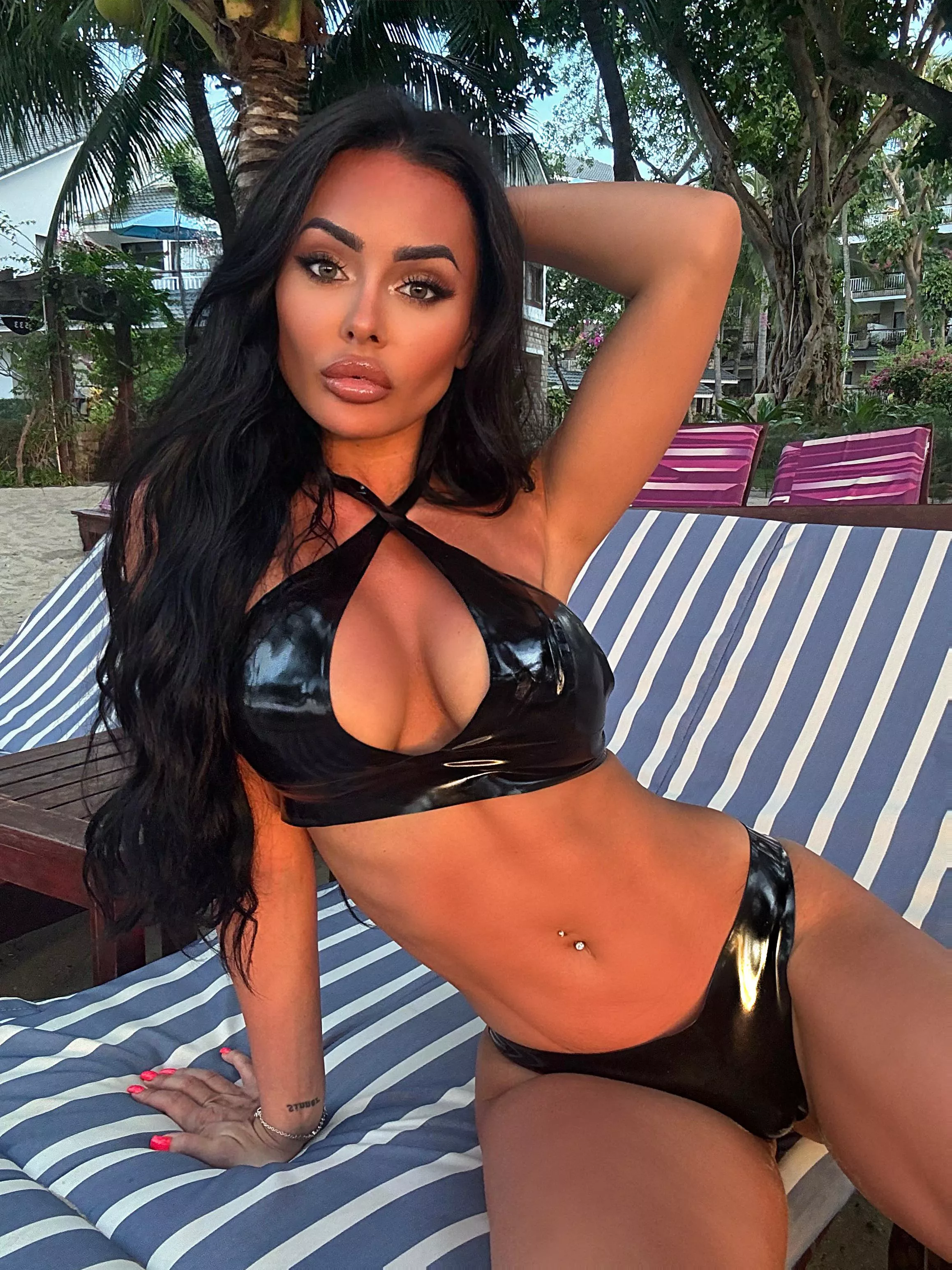 Latex on public beach posted by evilwomanqueen