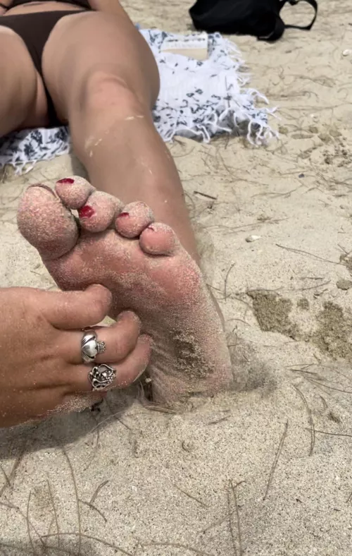Tickling her feet at the beach! by syhoney