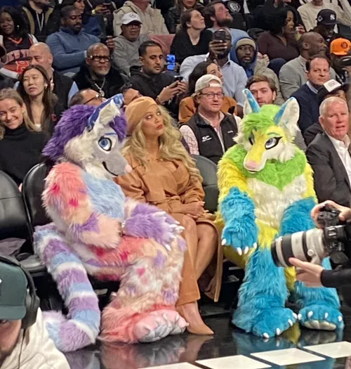 Tyra Banks watching a Basketball game with two adorable fluffs and she's like rolling with it by Rejector71