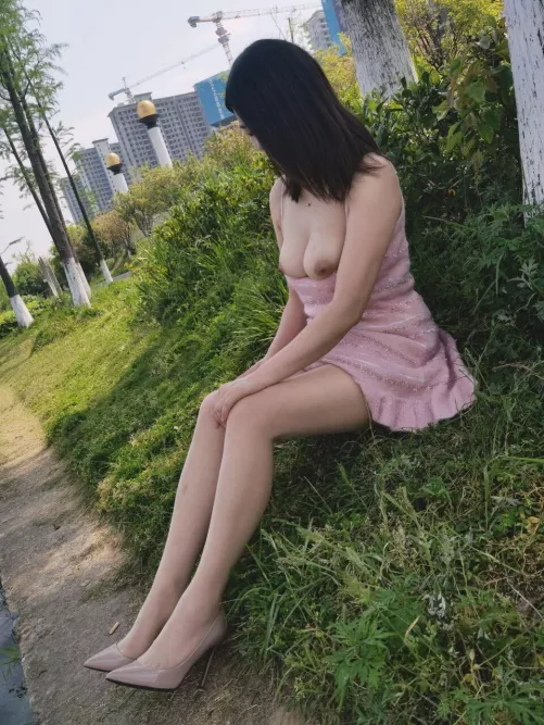 Exposing her tits in a public park by CaptainUndie