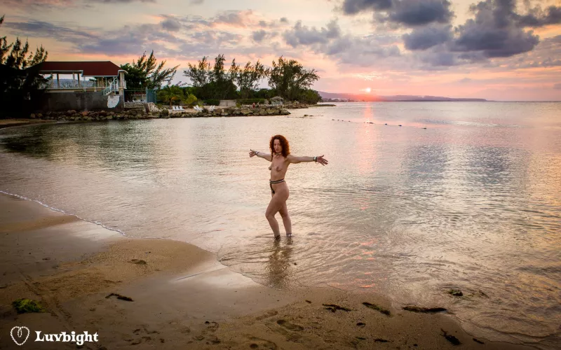 Wide shot of Dee Luvbight on the prude beach at sunset, Hedonism III, Runaway Bay, Jamaica (2008). by MickLuvbight