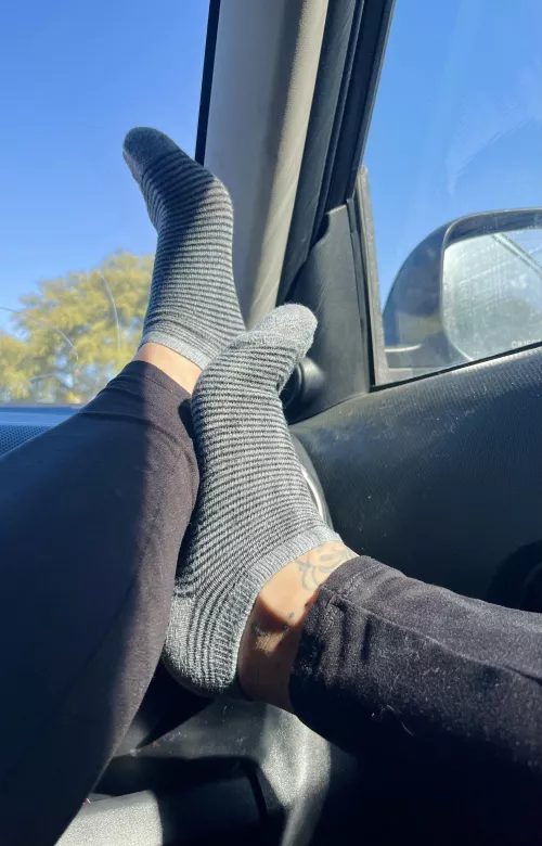 Resting my tiny feet in ankle socks on the dash by Lollipoptoes22