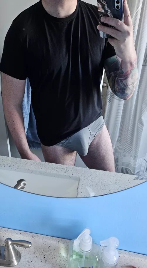 These grey briefs are one of my favorite for showing my bulge. What do you think? by Massive_Ad6903