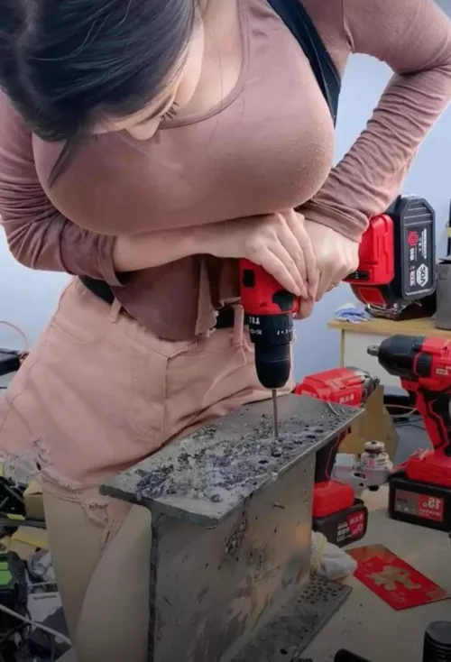 Who is this busty Asian girl using a power drill? by FrostyYouth2937