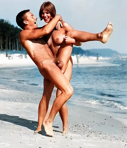 Restored photo of a happy couple enjoying a freeing day on the beach in 1950's Germany. by FerralPassenger