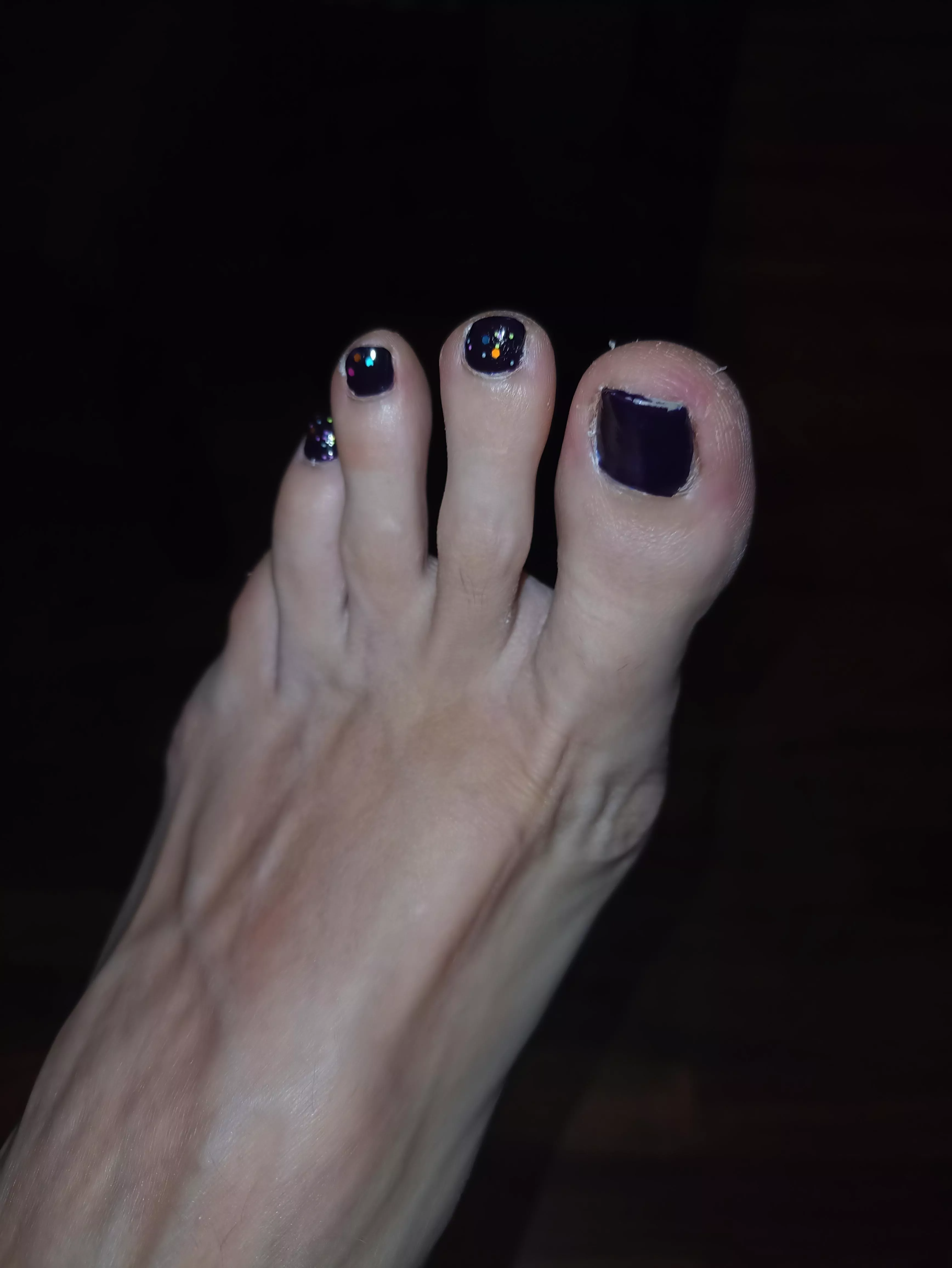 Do you like how the black polish looks on me? posted by claritafeet