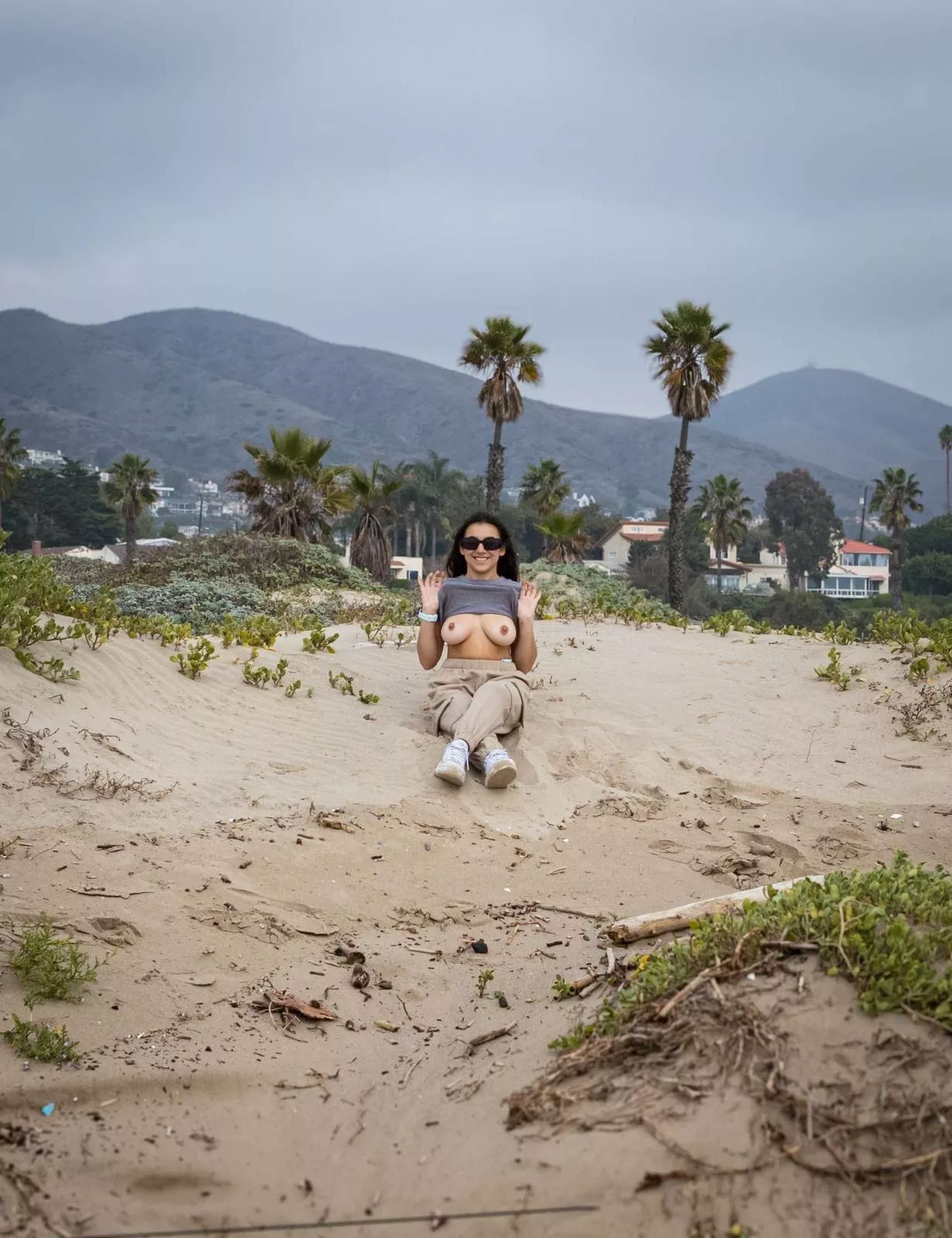 Here I am flashing my boobs on a public beach. posted by Daisy_Hood