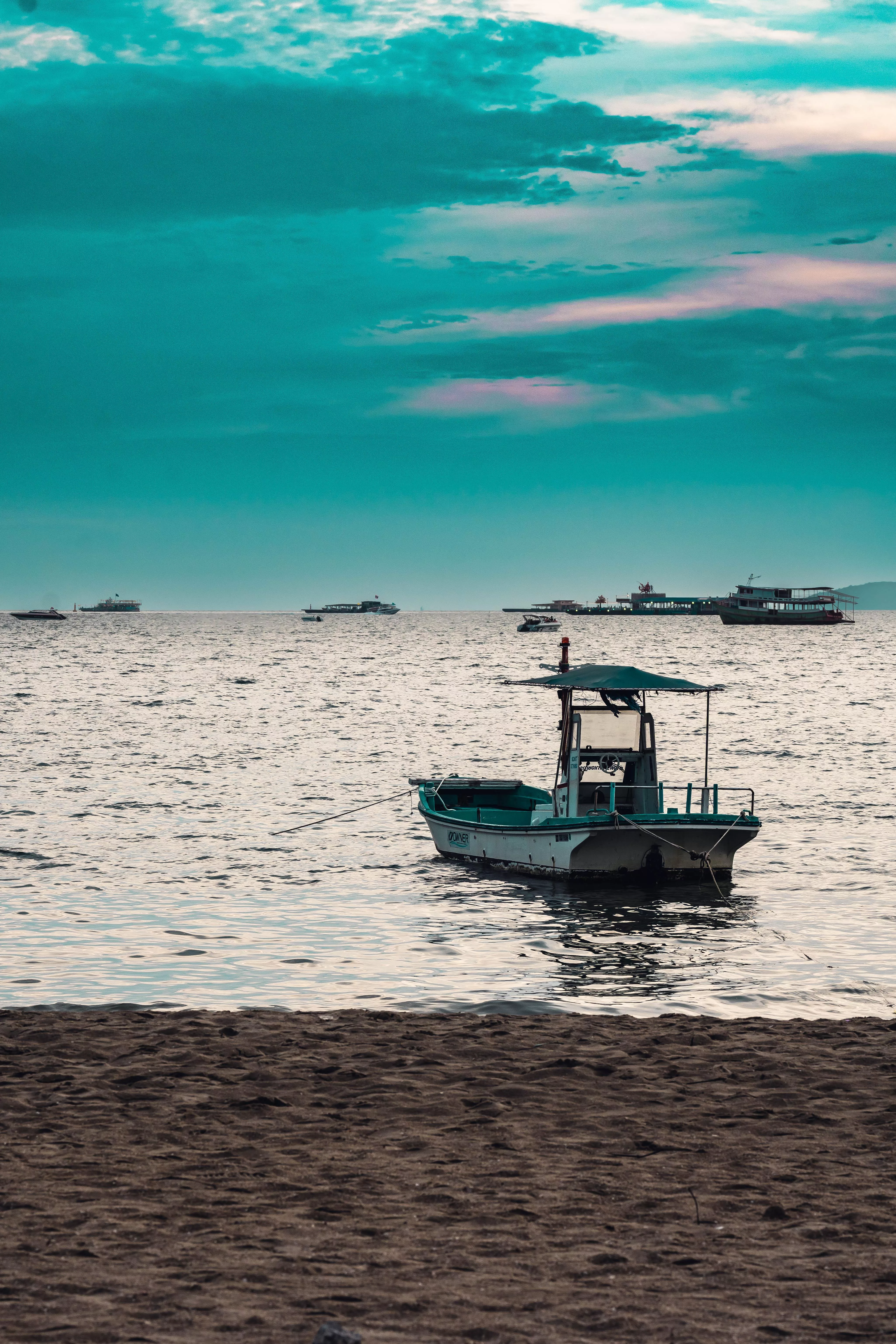 ITAP boat near beach at sunset posted by Homo1udens