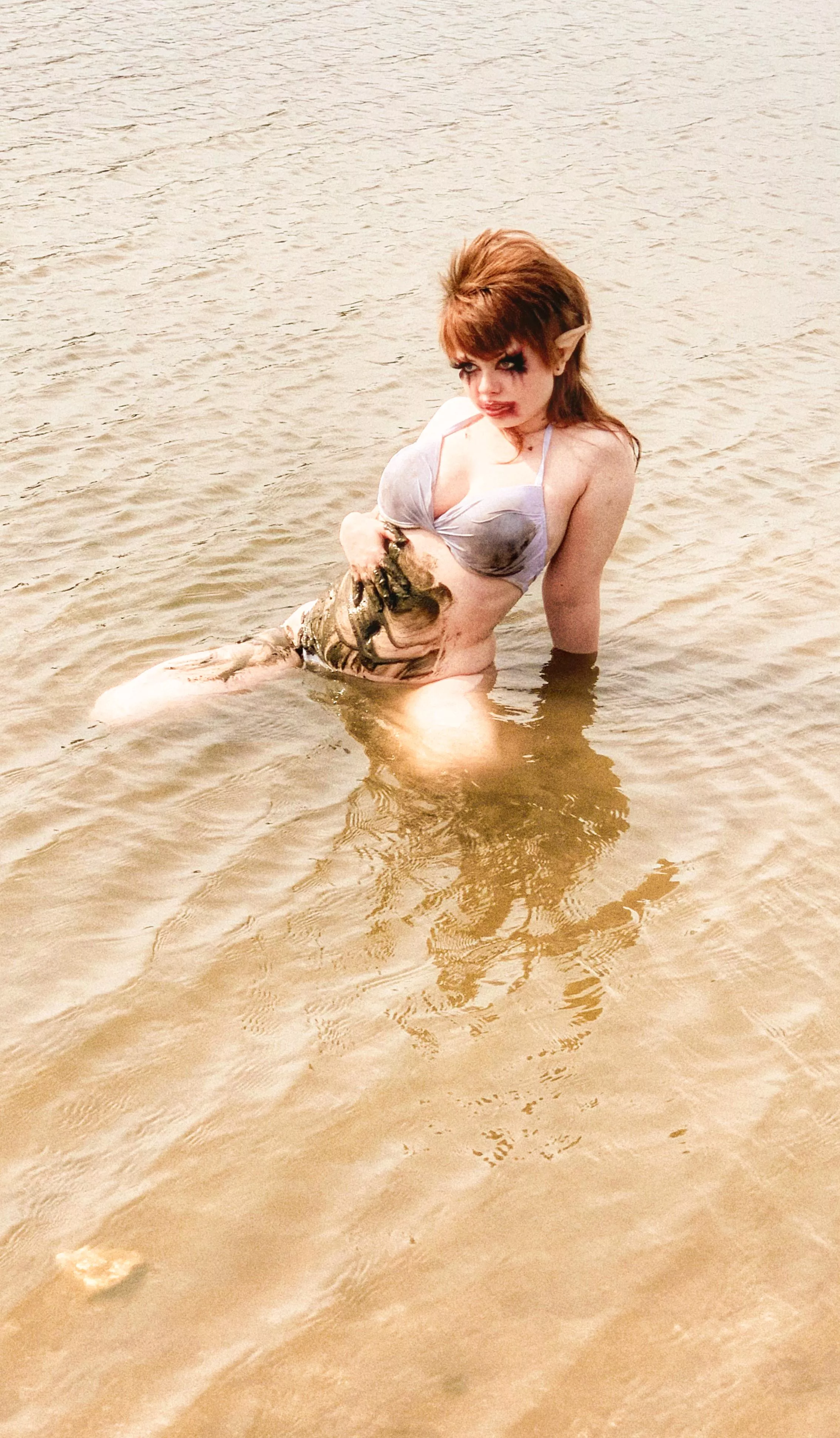 Elf girl playing in the mud posted by Scarlettclown