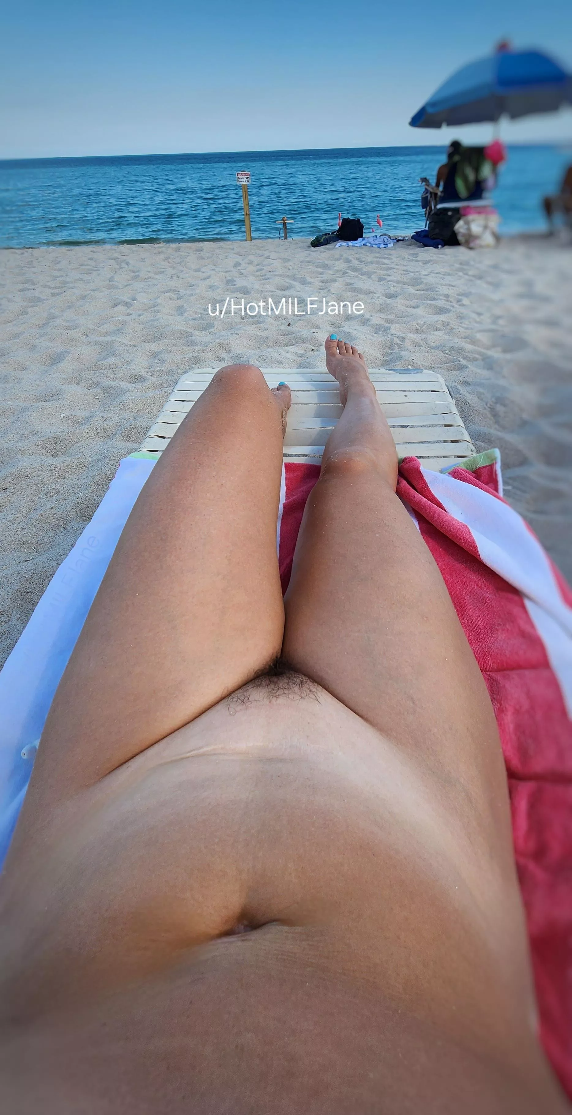 Nude at the beach surrounded by dozens of people  posted by HotMILFJane