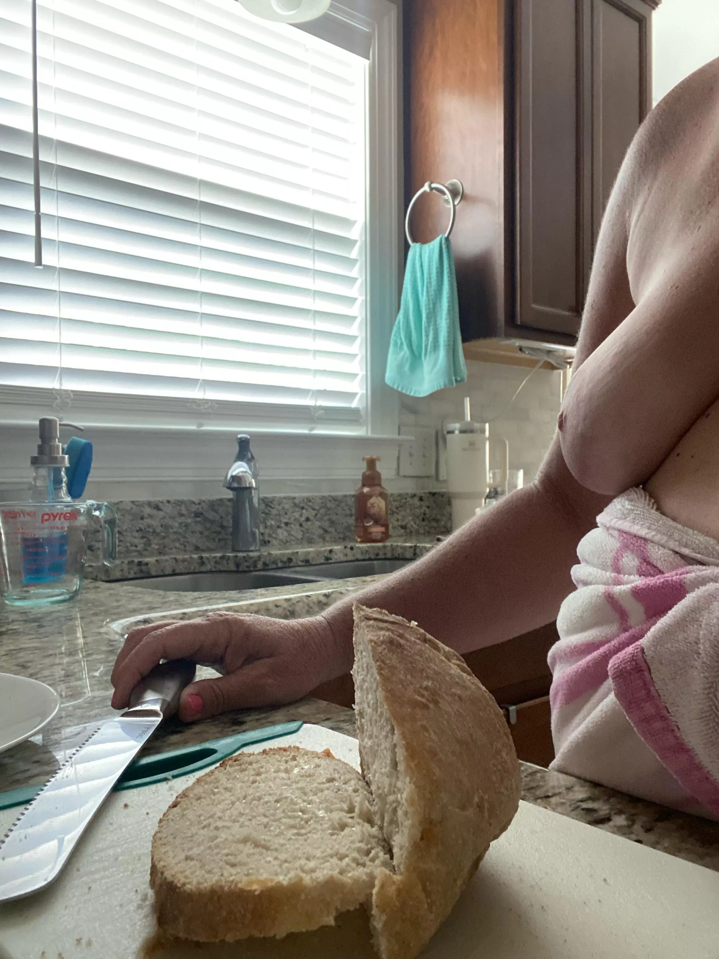 Cutting some bread posted by Jillneedalife