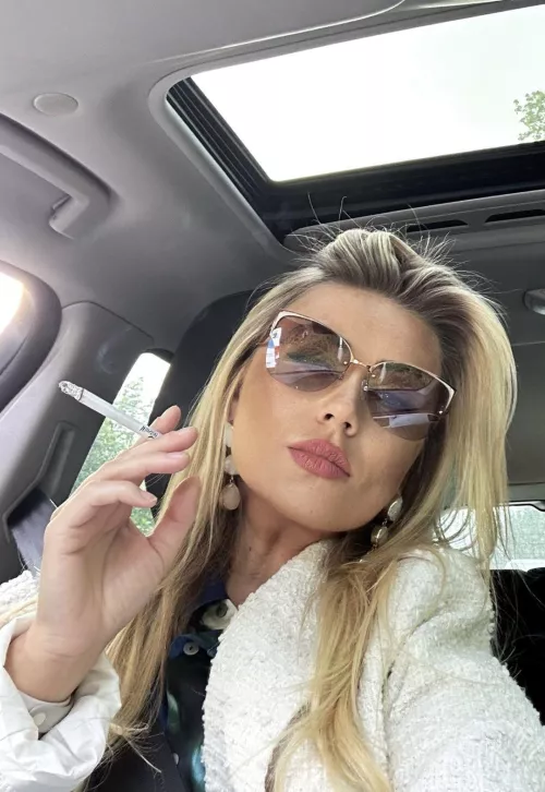 Self-assured and smoking in her car by darkpoetries