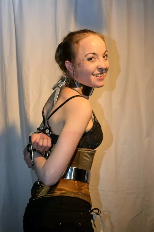 Metal bondage and a smile by bigdadwolf_