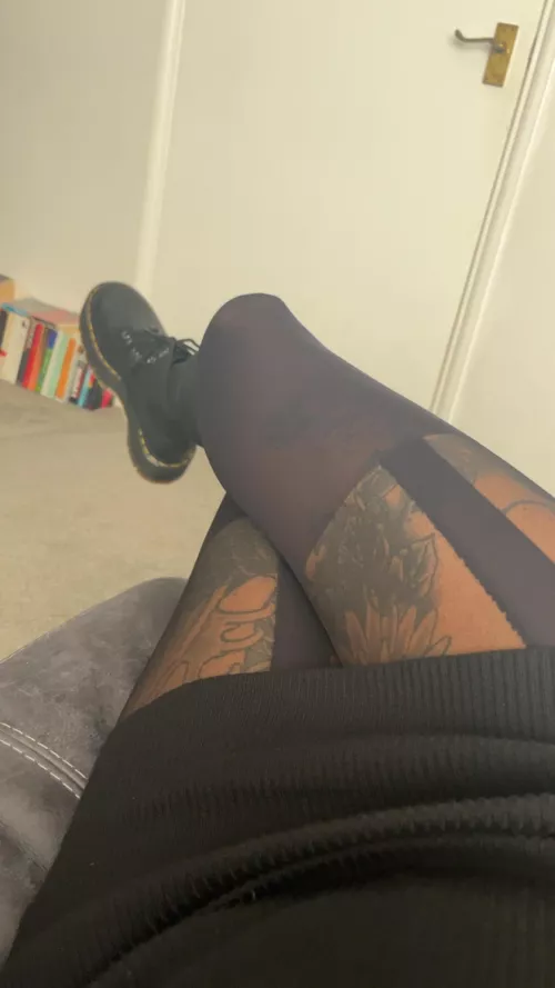 Tights hugging curves, legs adorned in sleek fabric, paired with the edgy allure of Doc Marten boots, style that's as bold as it is tantalizing. by Onyxxx85