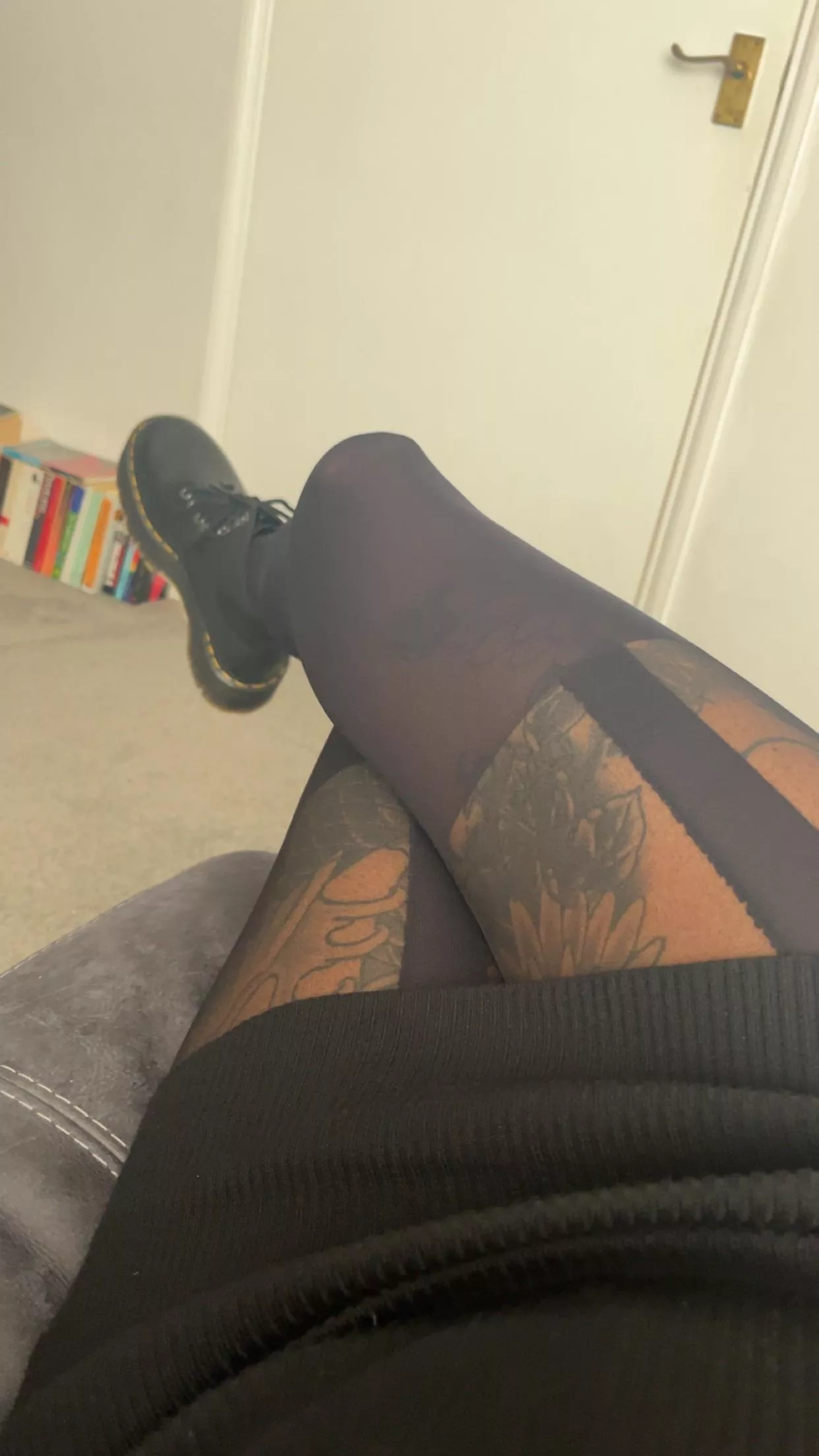 Tights hugging curves, legs adorned in sleek fabric, paired with the edgy allure of Doc Marten boots, style that's as bold as it is tantalizing. posted by Onyxxx85