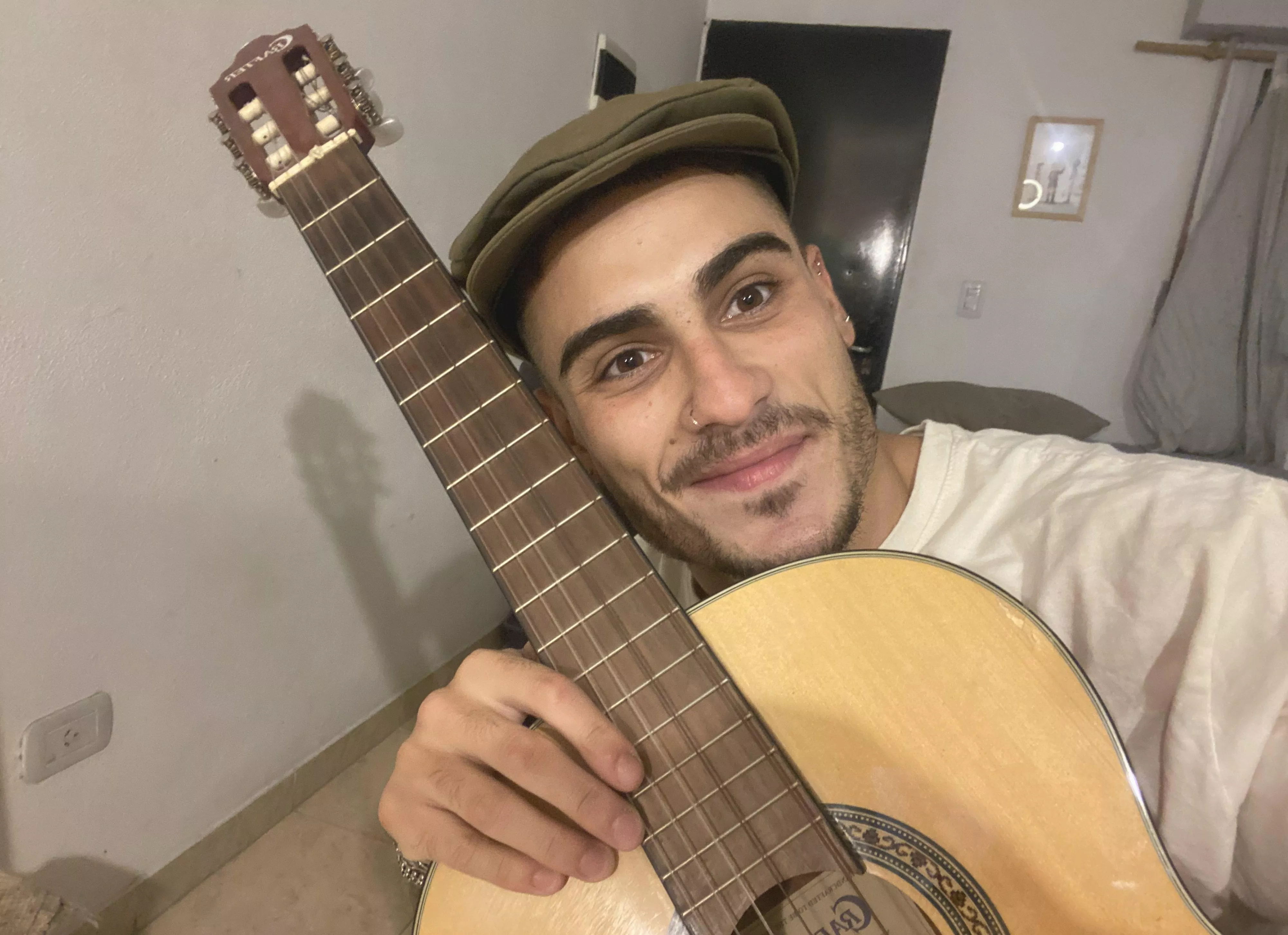 Just relaxing with my guitar posted by SlowStrength929