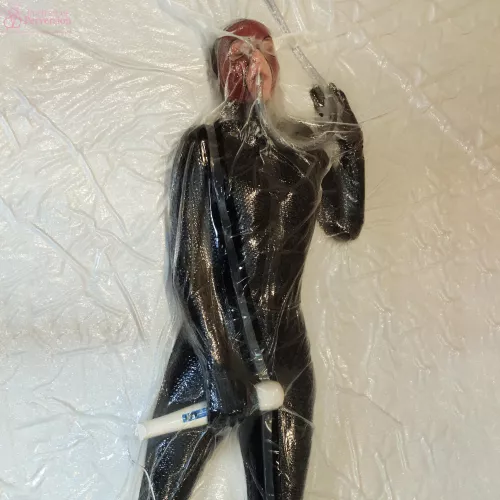 Dollified: A Vacuum-Sealed Rubber Toy Getting Itself Off With A Magic Wand by PortraitOfPerversion