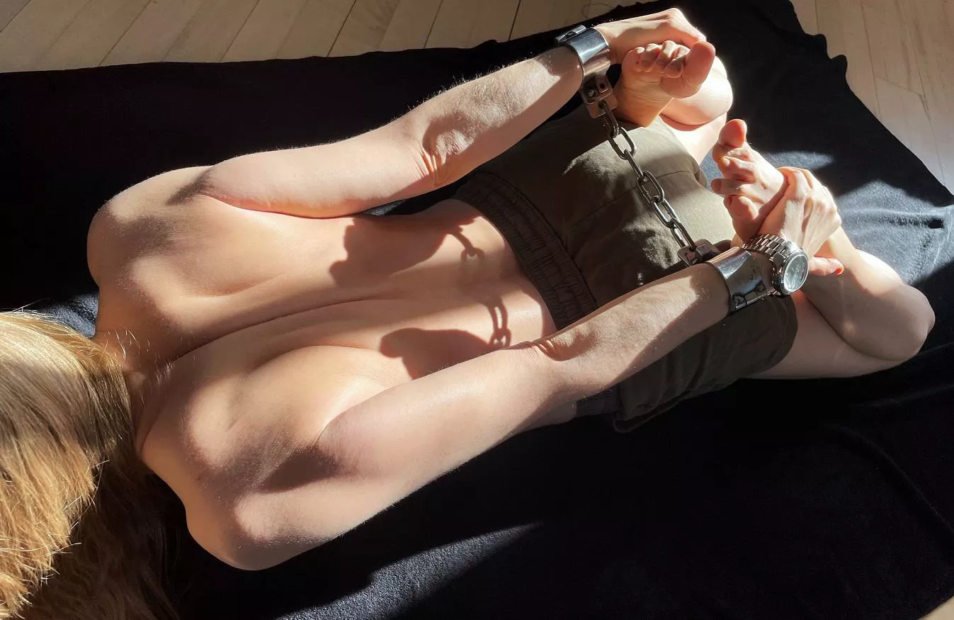 Enjoying my shackles and the sun on my skin posted by JessicaShackled