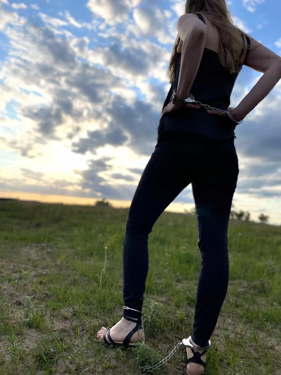 Enjoying the sunset in cuffs posted by JessicaShackled