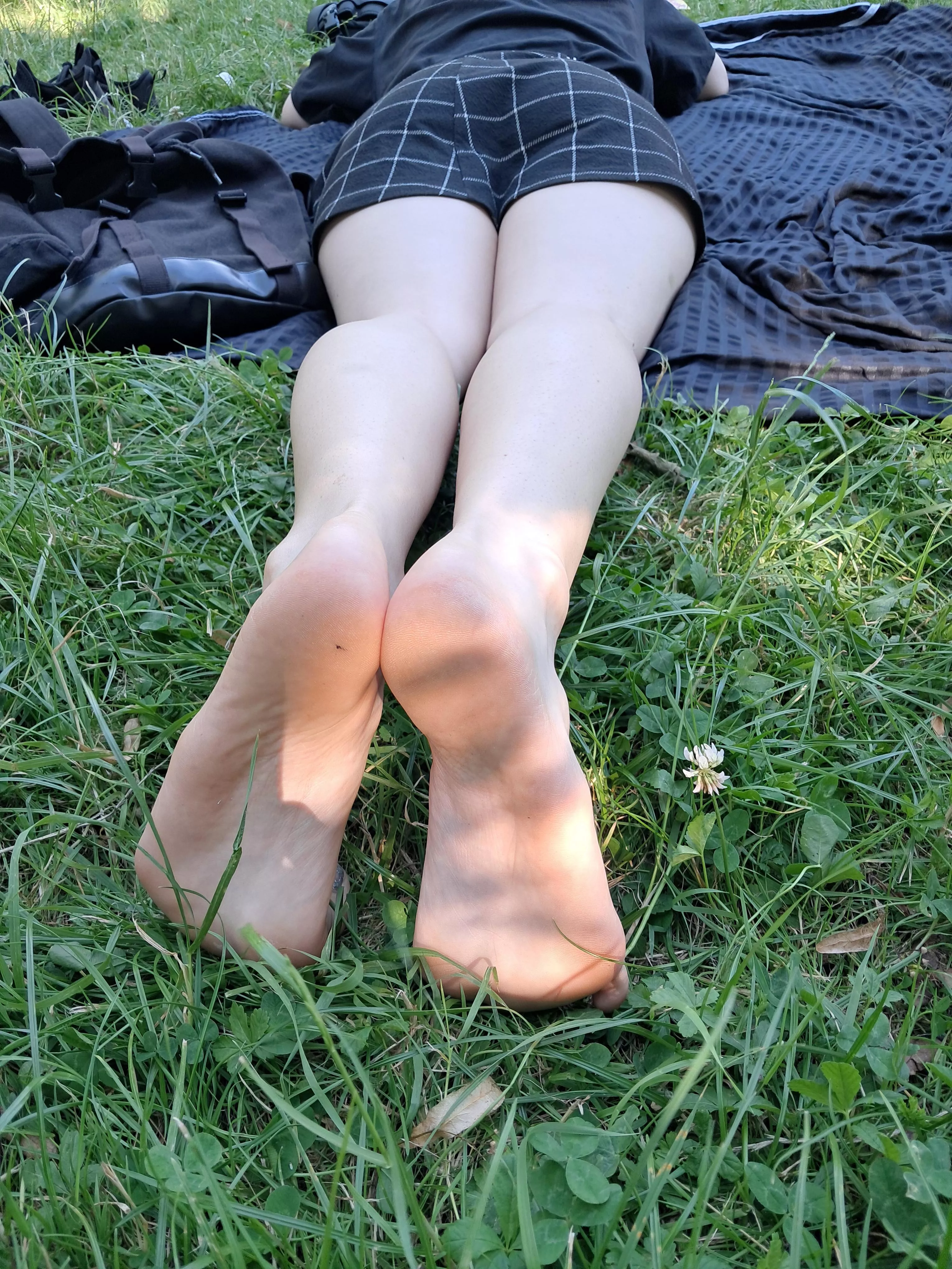 Laying in the grass posted by sarahsfeetblog