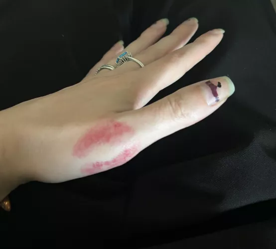 Hand with a lipstick kiss by sirenskiss3