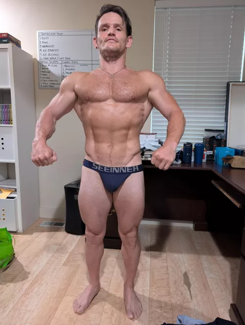 Practicing bodybuilding poses by gayvittles