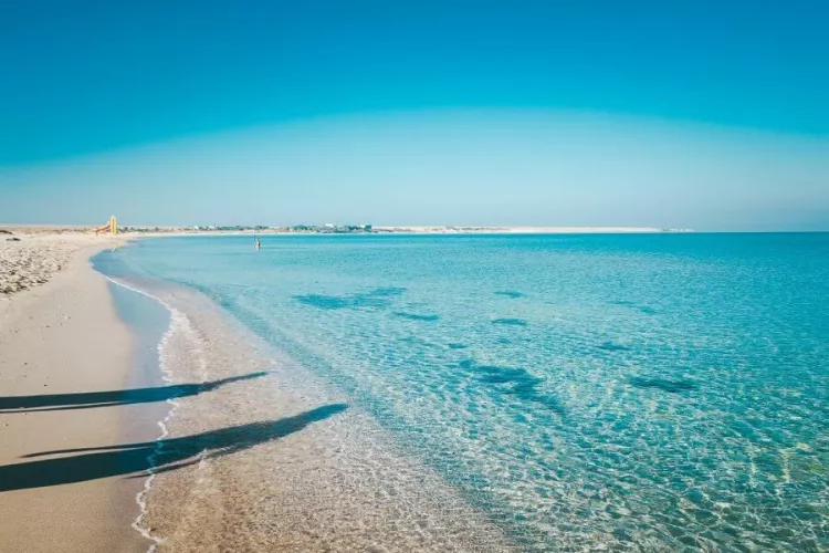 Beautiful white sand beach in calm weather by mercury0913