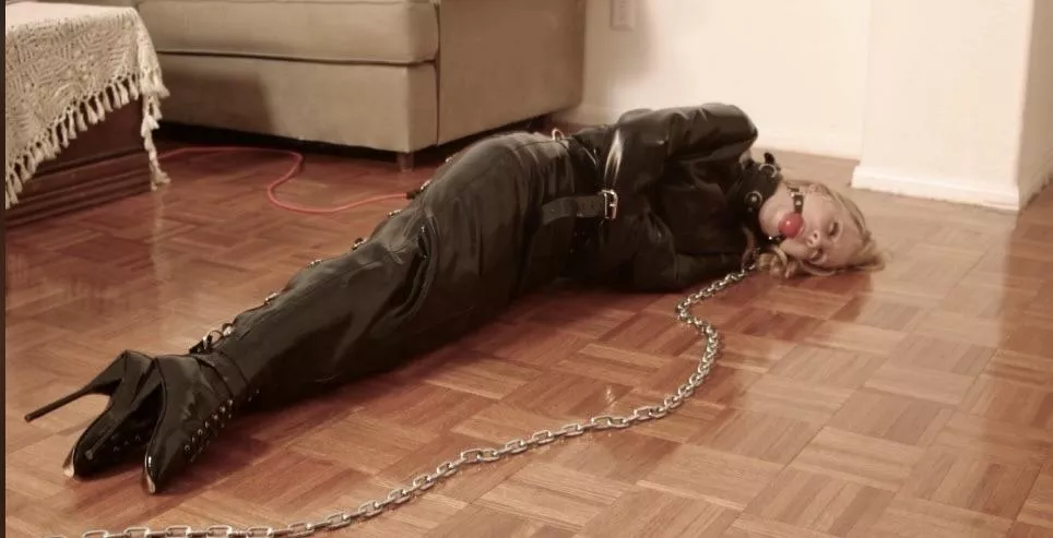 Slave in latex dress and straitjacket.  posted by Declan_Lujan