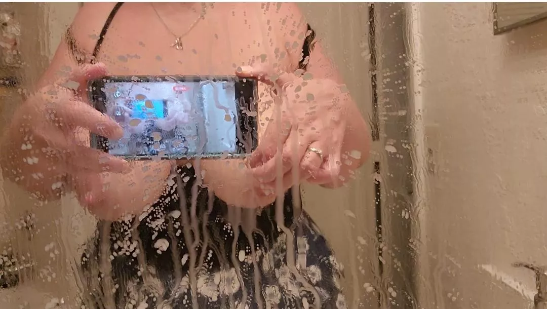 Spraying the mirror posted by Spidette