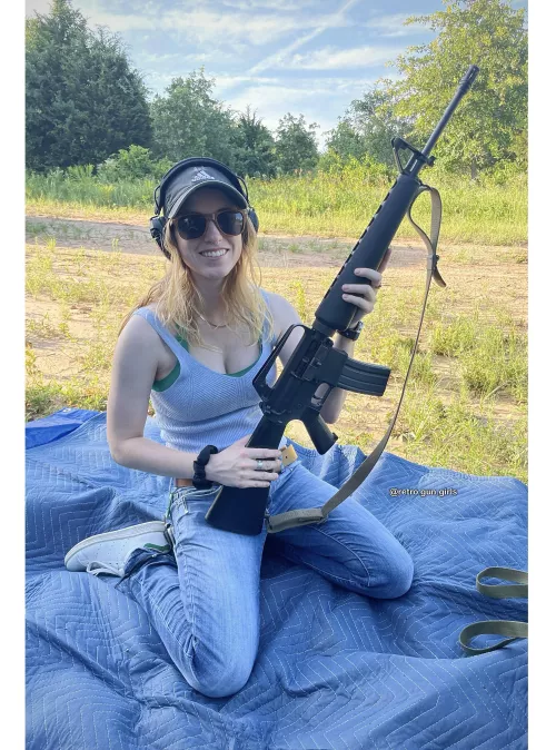 Blonde girl with Colt Sporter AR15  by RetroGunGirls