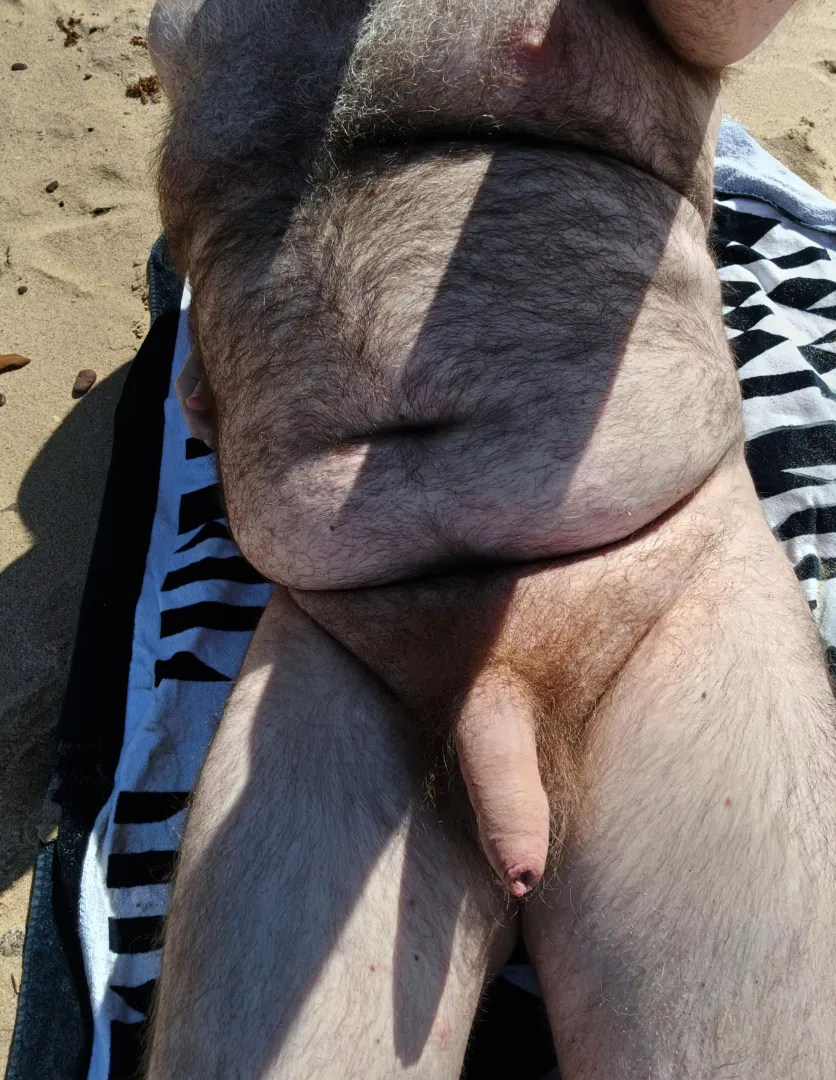 Enjoying the sun at the beach  posted by nudebiaussie