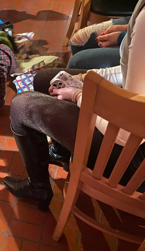 Shimmery hose and boots at holiday party by silkyhose2024