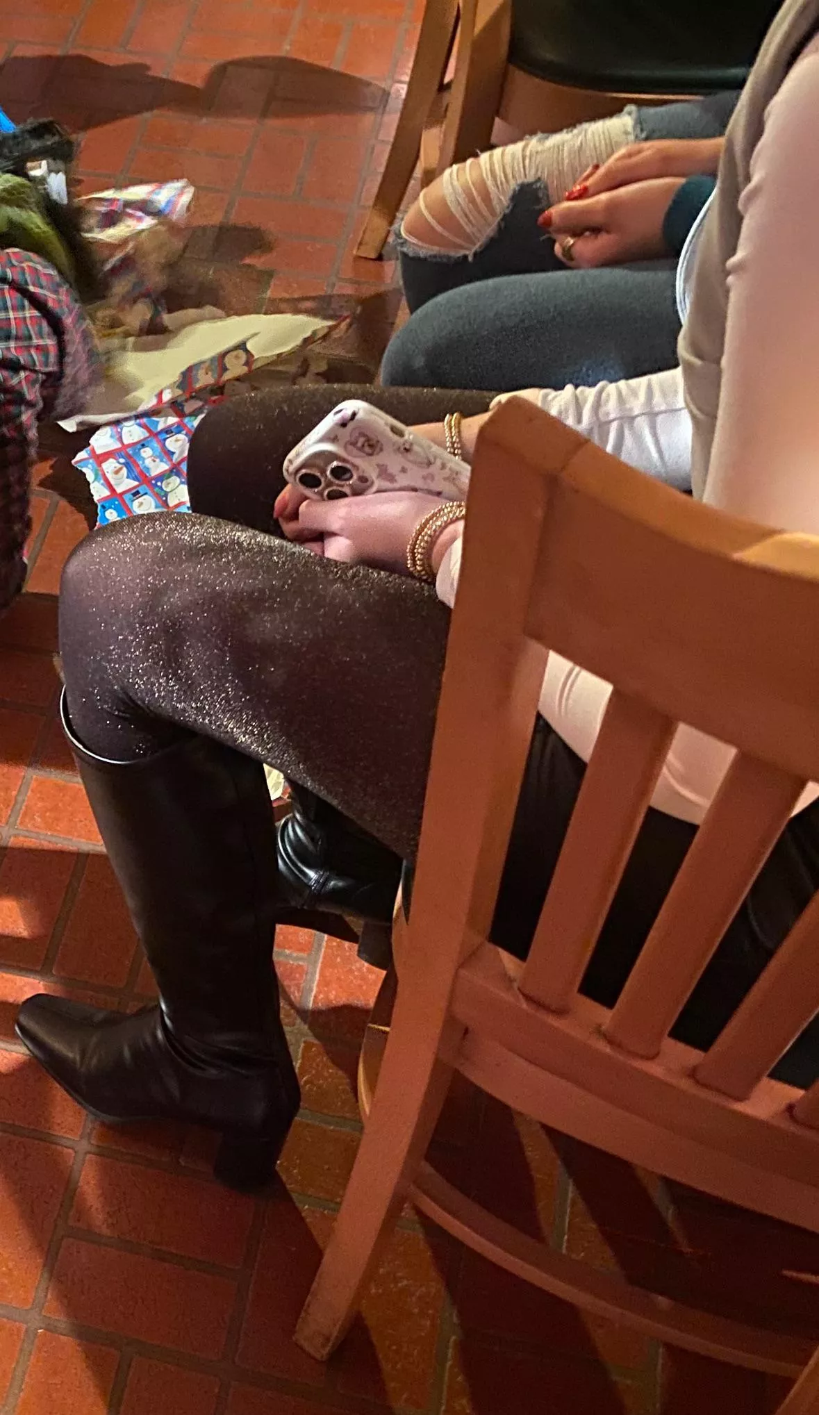 Shimmery hose and boots at holiday party posted by silkyhose2024